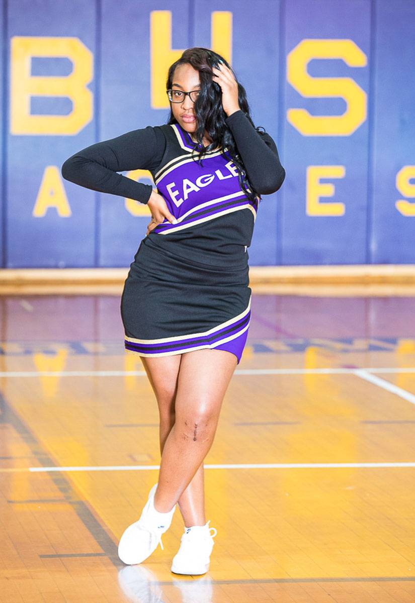A woman wearing a cheerleader outfit