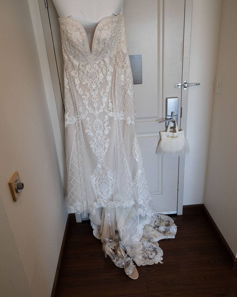 The bride’s wedding dress at the door