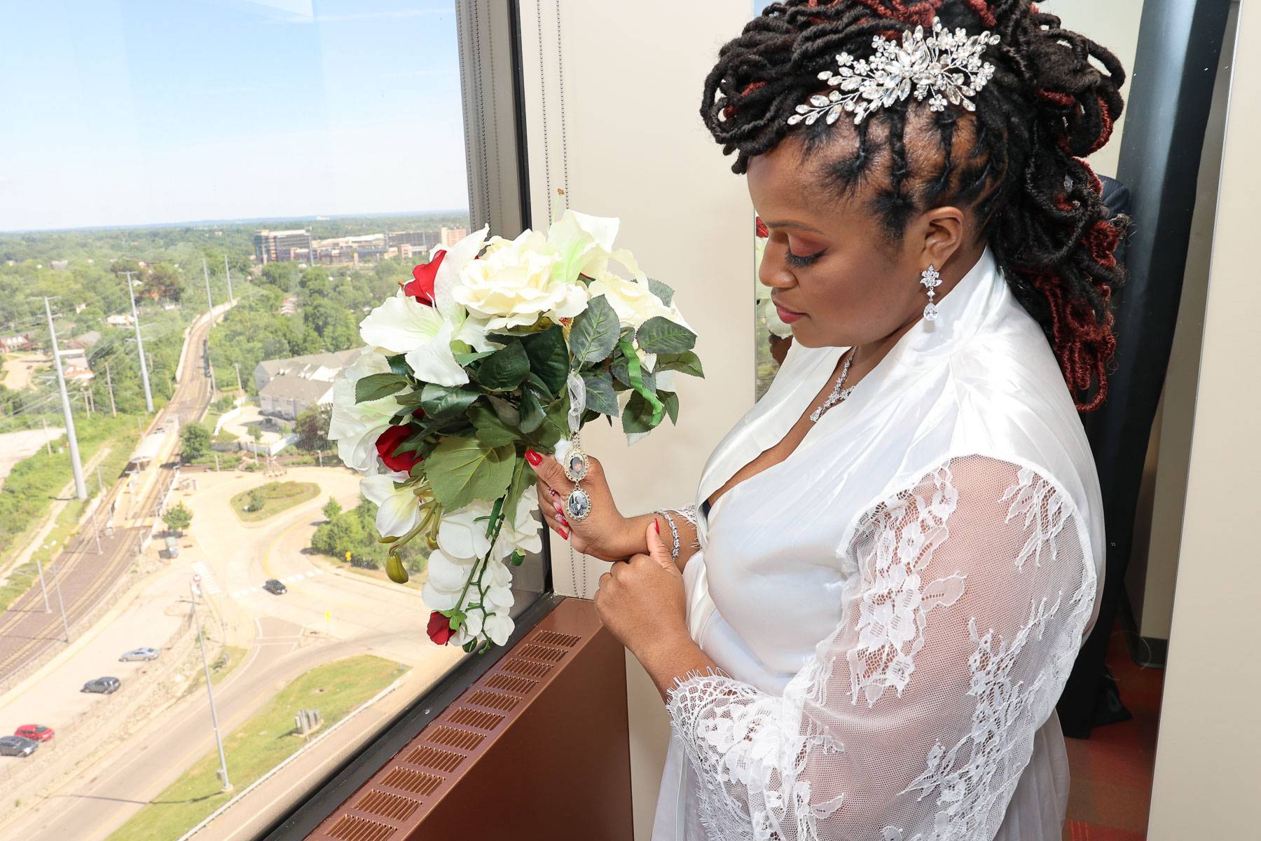 The bride holding the bouquet and locket