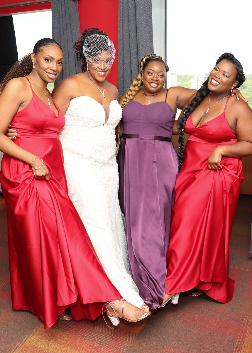 The bride and her three bridesmaids putting their feet forward