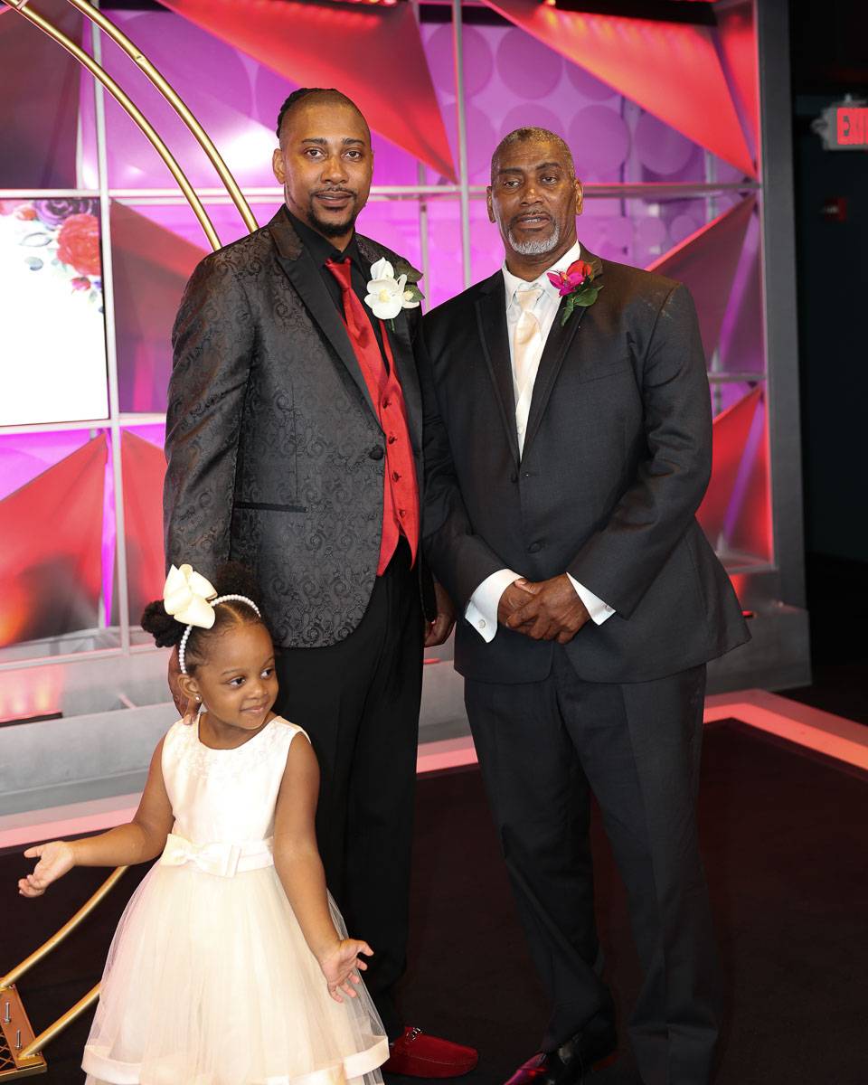 The groom with his father and a toddler