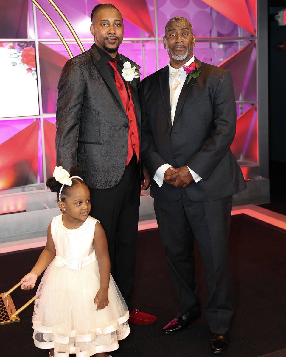 The groom with his father and a young girl