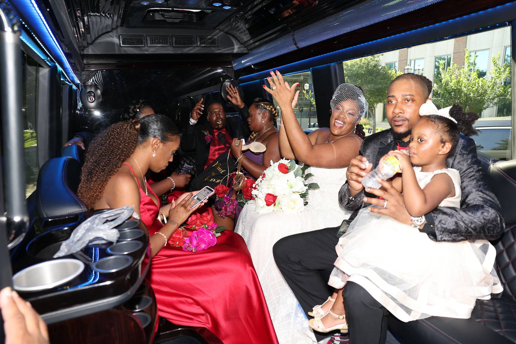The newlyweds and their attendants resting in the limo