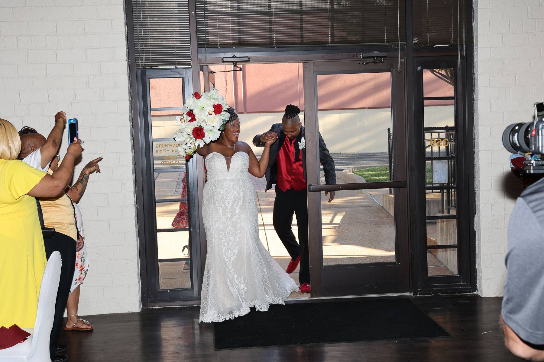 The bride and groom enter through the doors