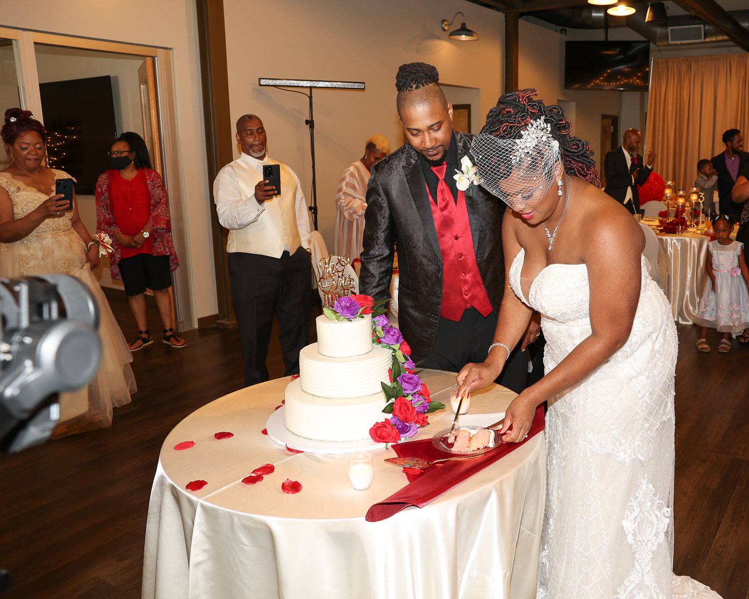The bride putting two cake slices on the plate