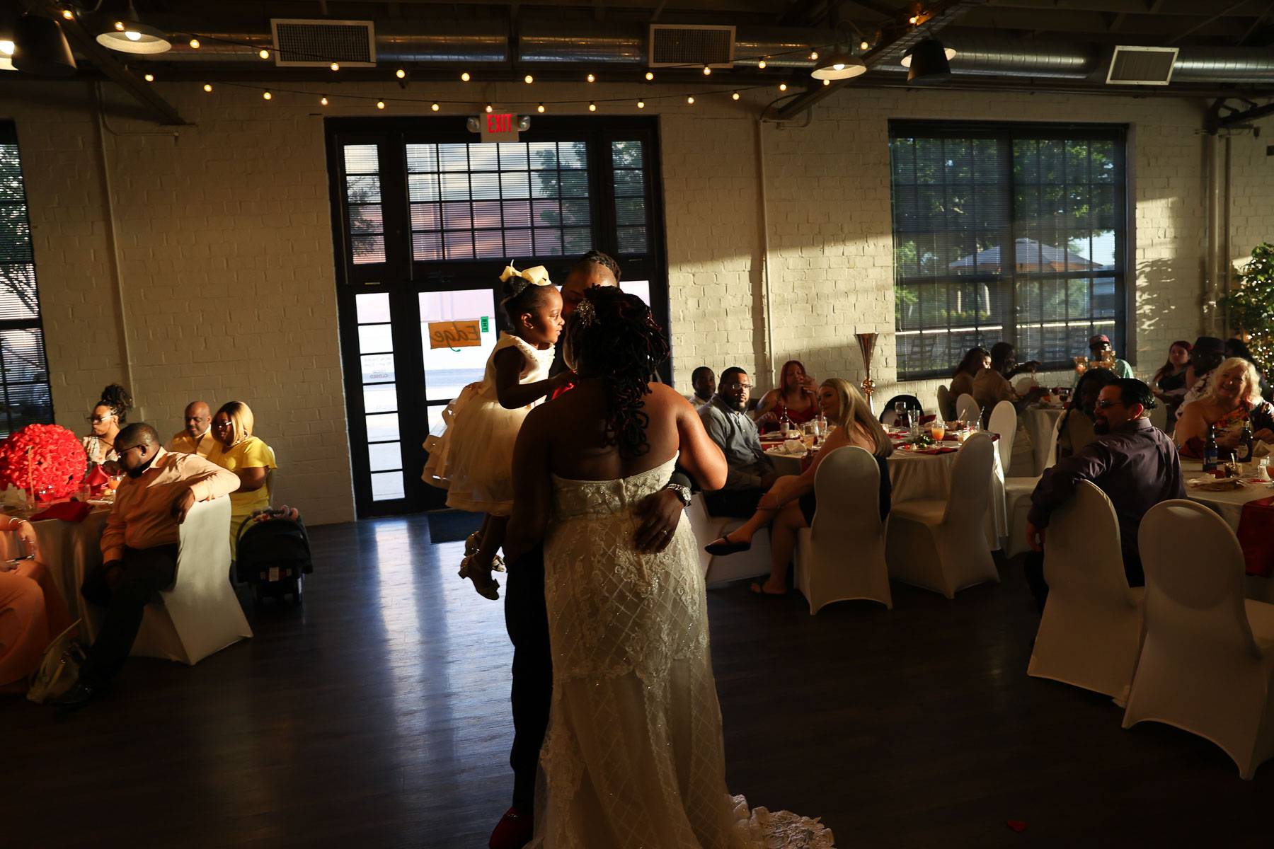 The newlyweds standing at the center of the hall