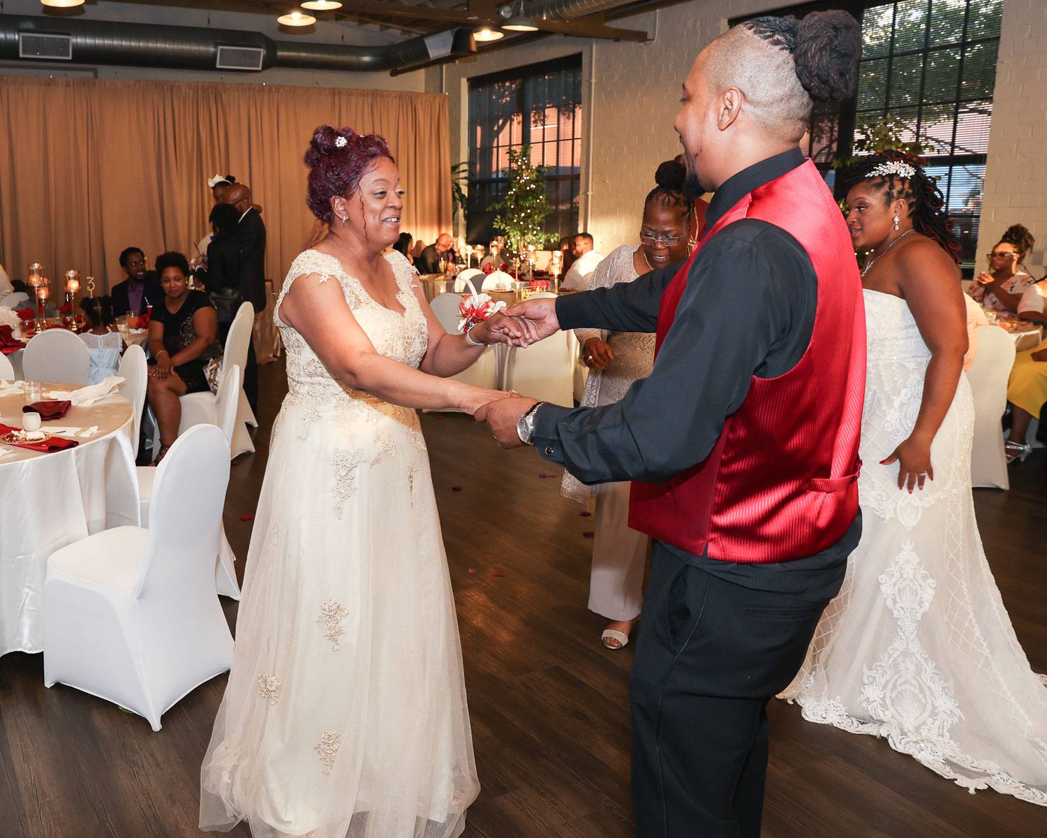 The groom dancing with his mother-in-law gently