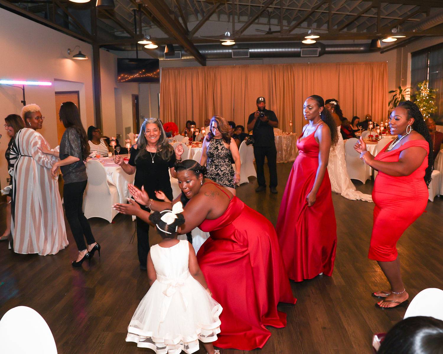The bridesmaids dancing with the young girls