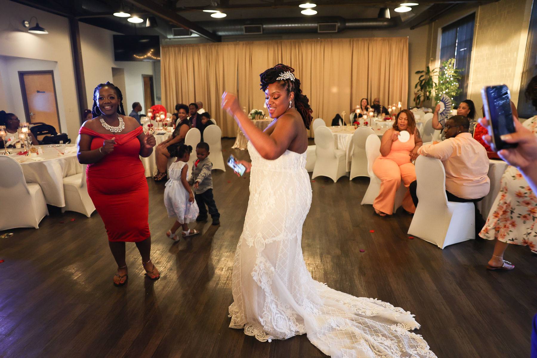 The bride dancing in her wedding dress