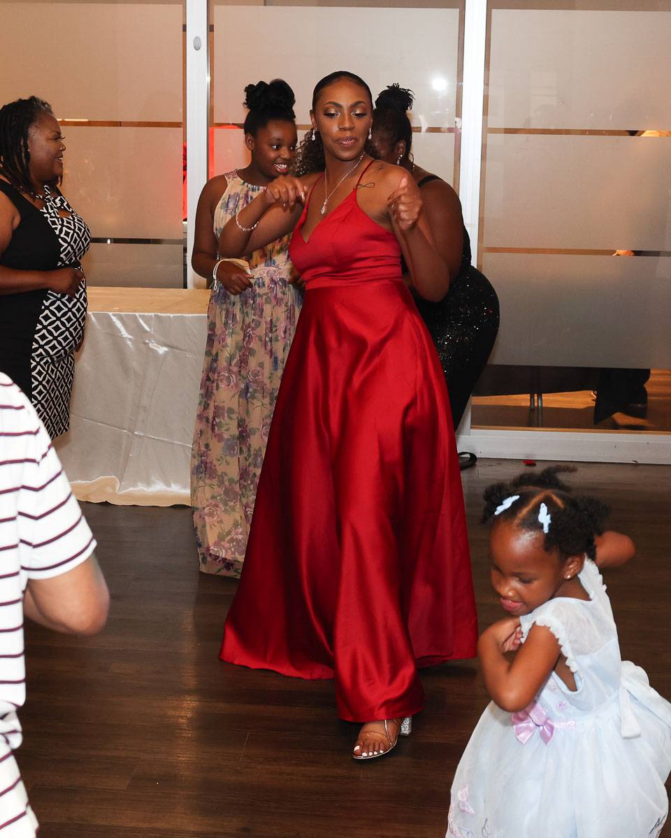 A bridesmaid having a moment to dance