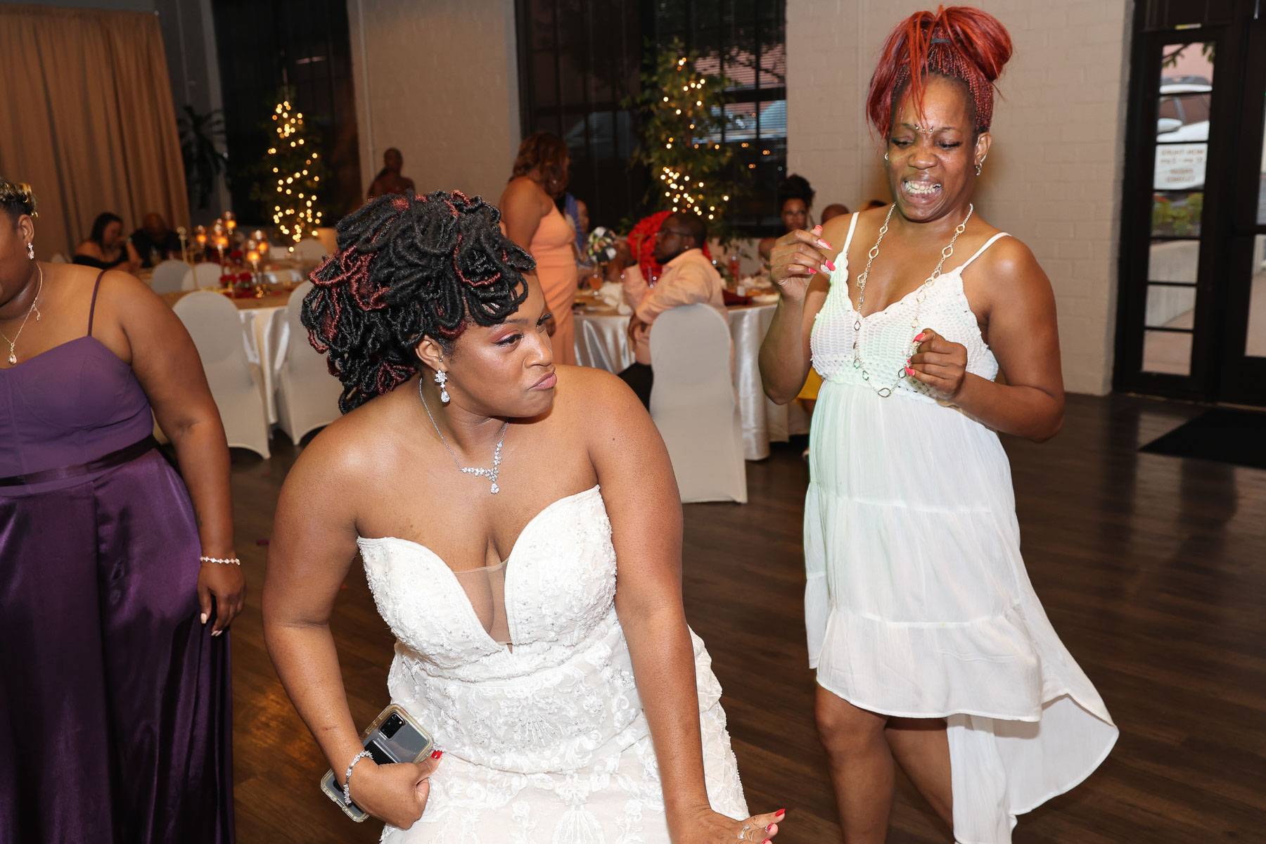 The bride with a guest dancing beside her