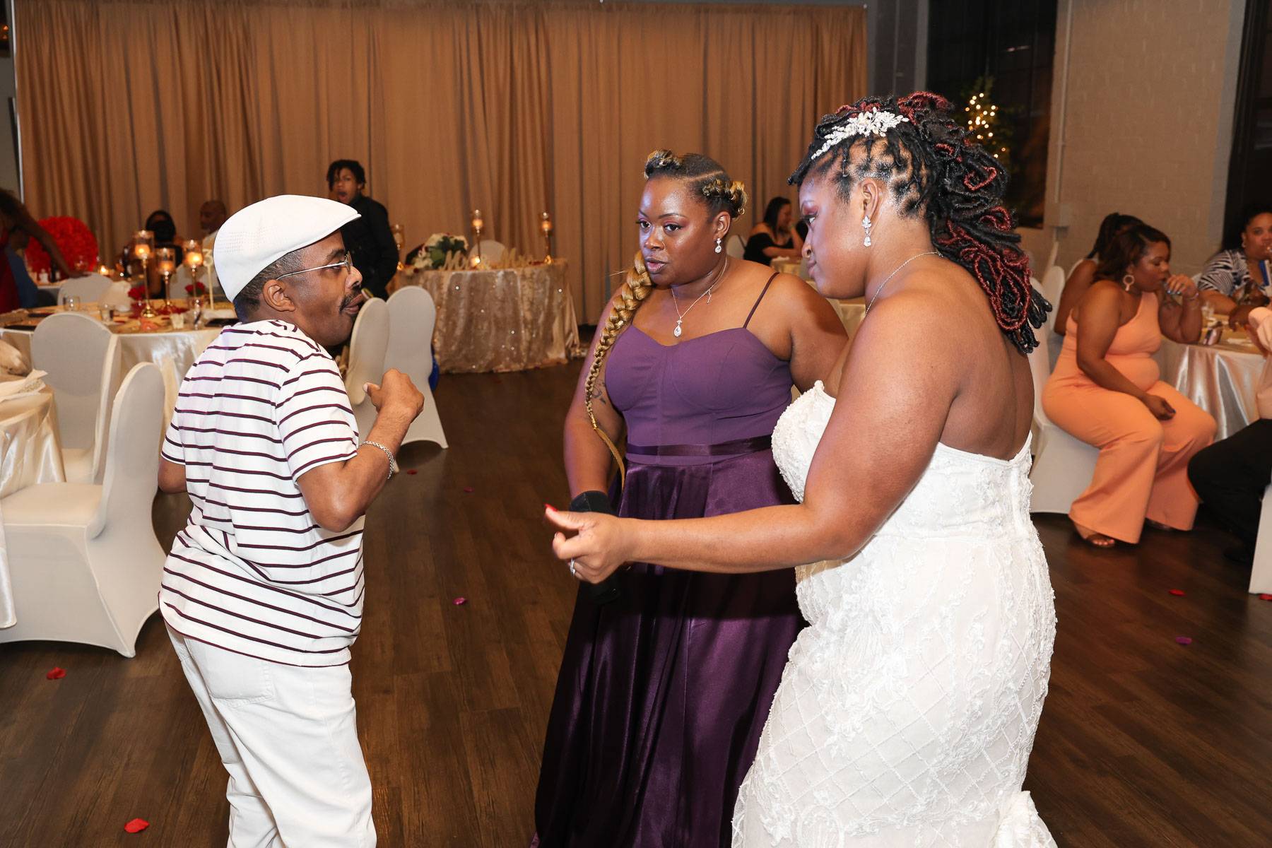 The bride and her two friends dancing