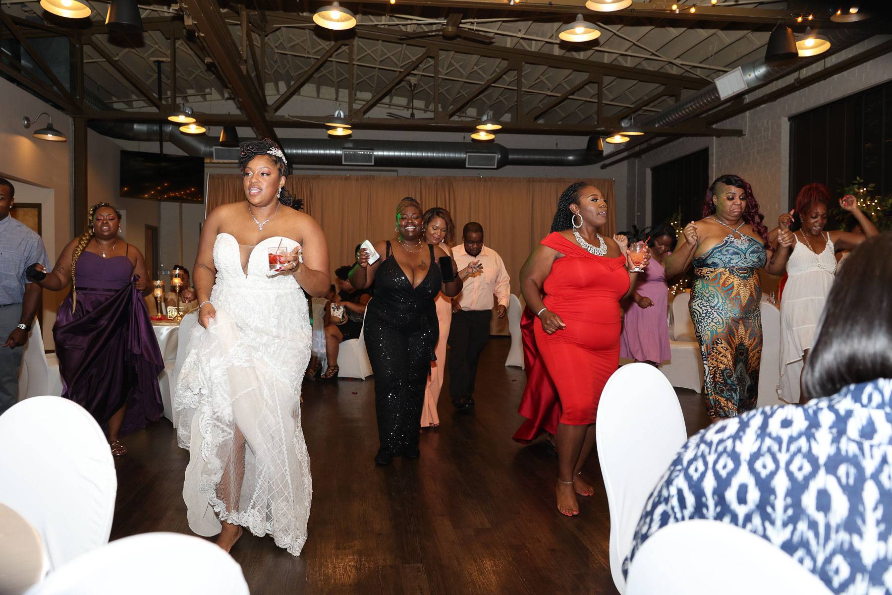 The bride and guests moving with the music