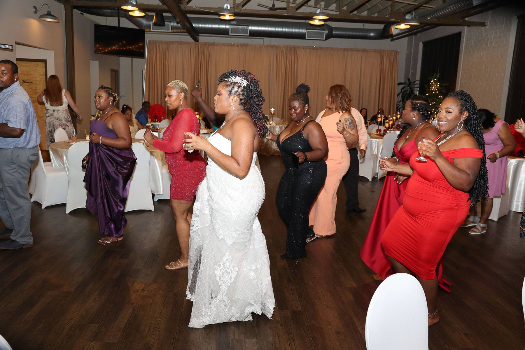 The bride and guests dancing the same style