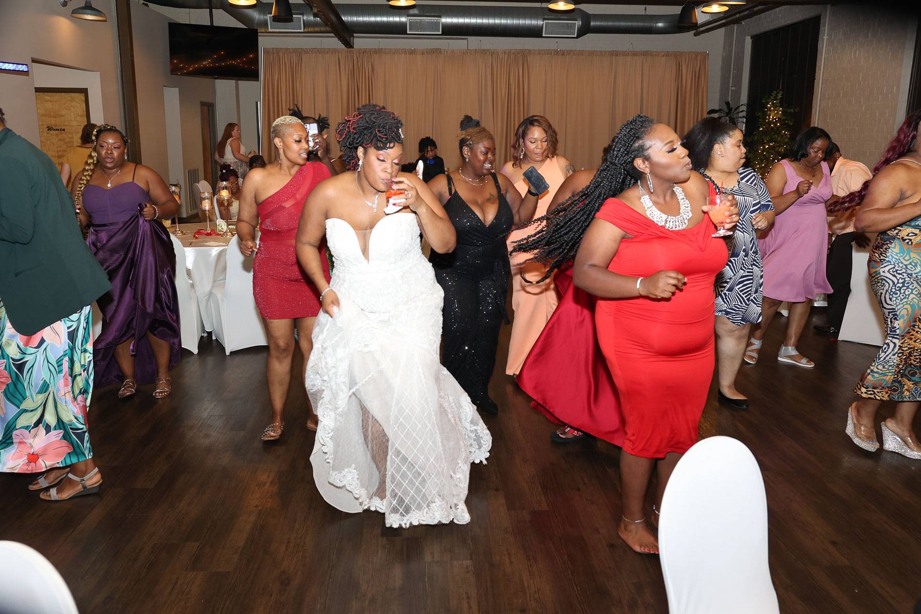 The bride and guests dancing with the same moves
