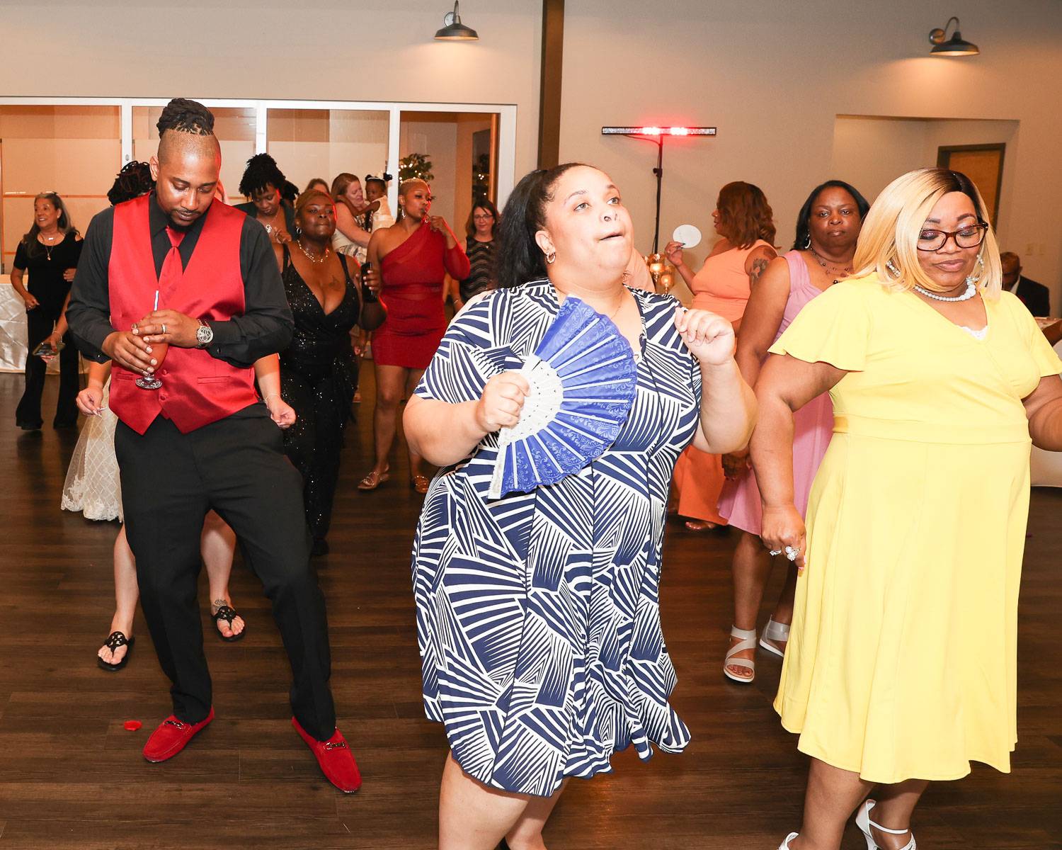 Happy wedding guests dancing