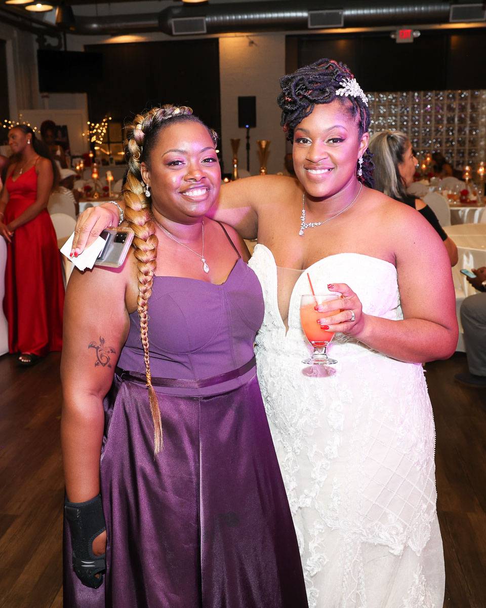 The bride and her friend in purple