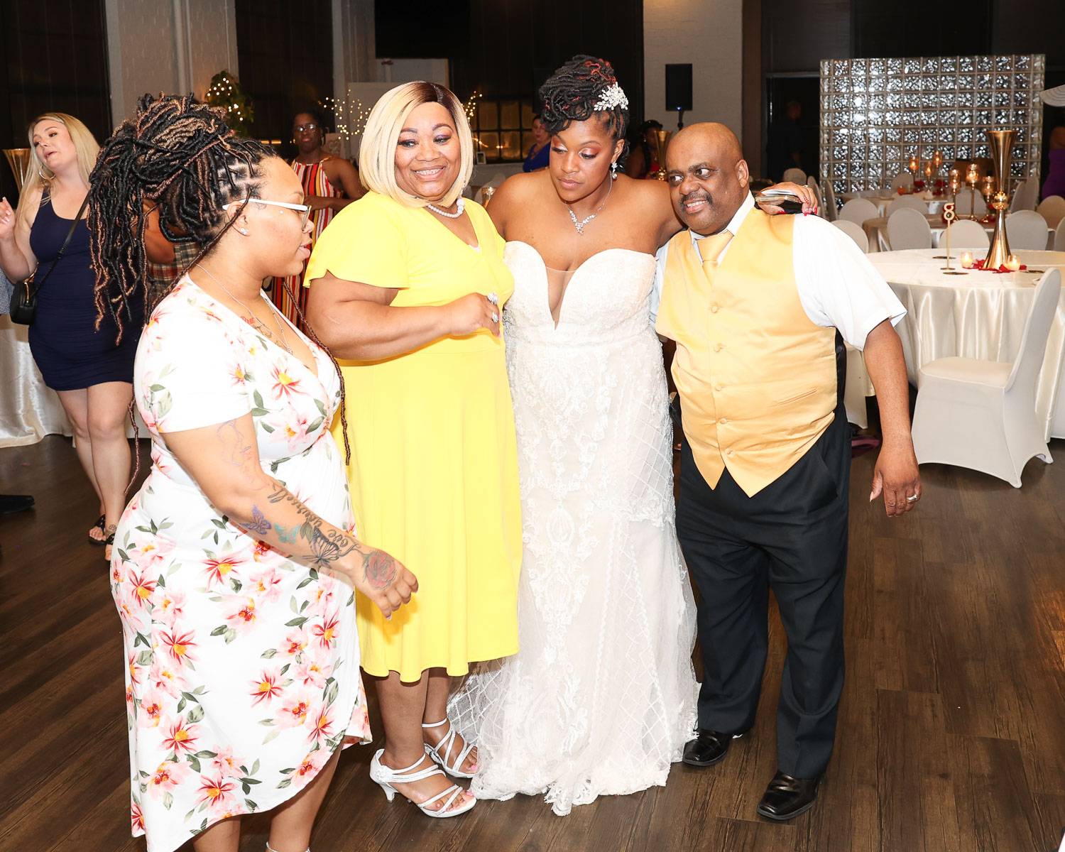The bride with guests wearing yellow