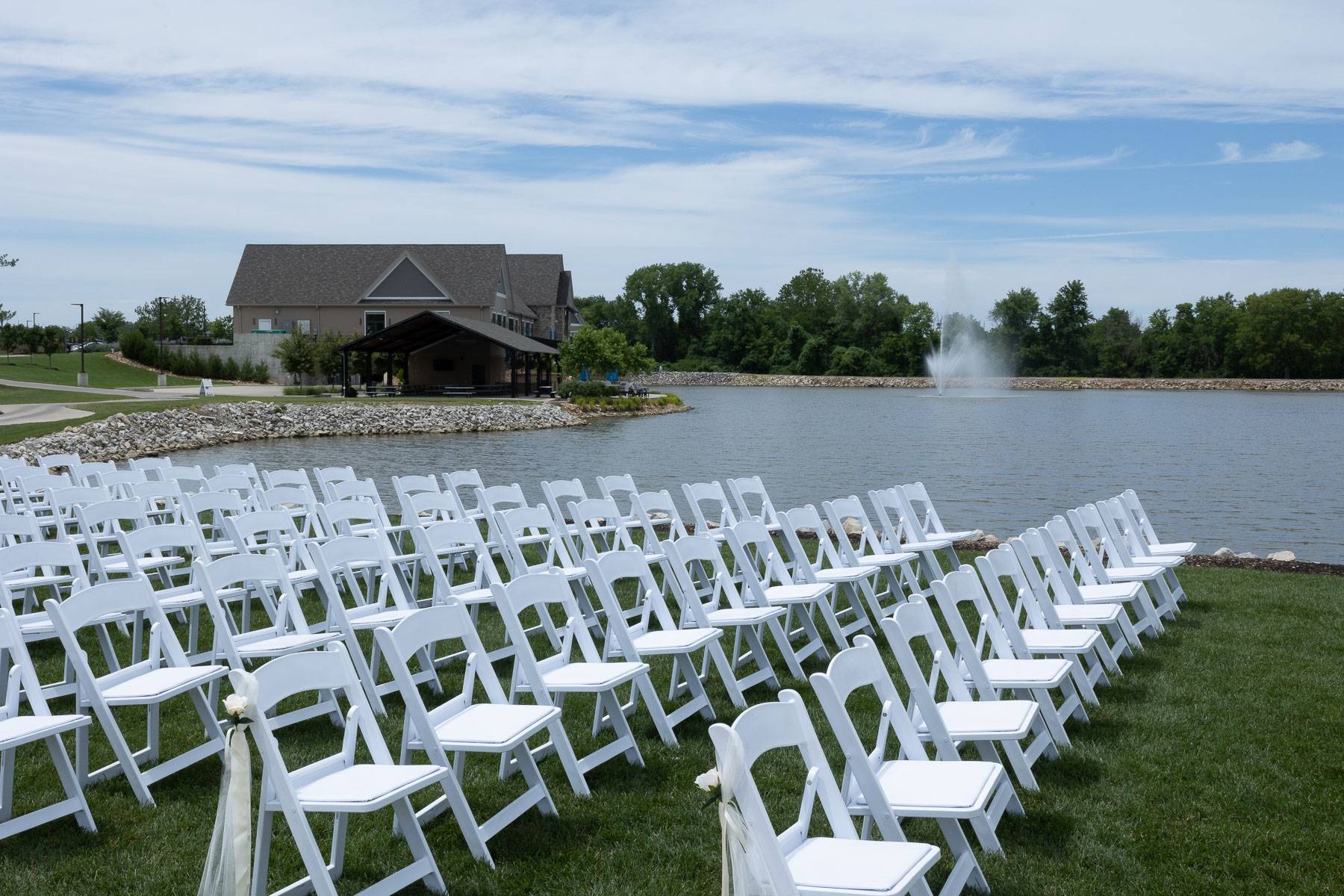 White chairs by a lake