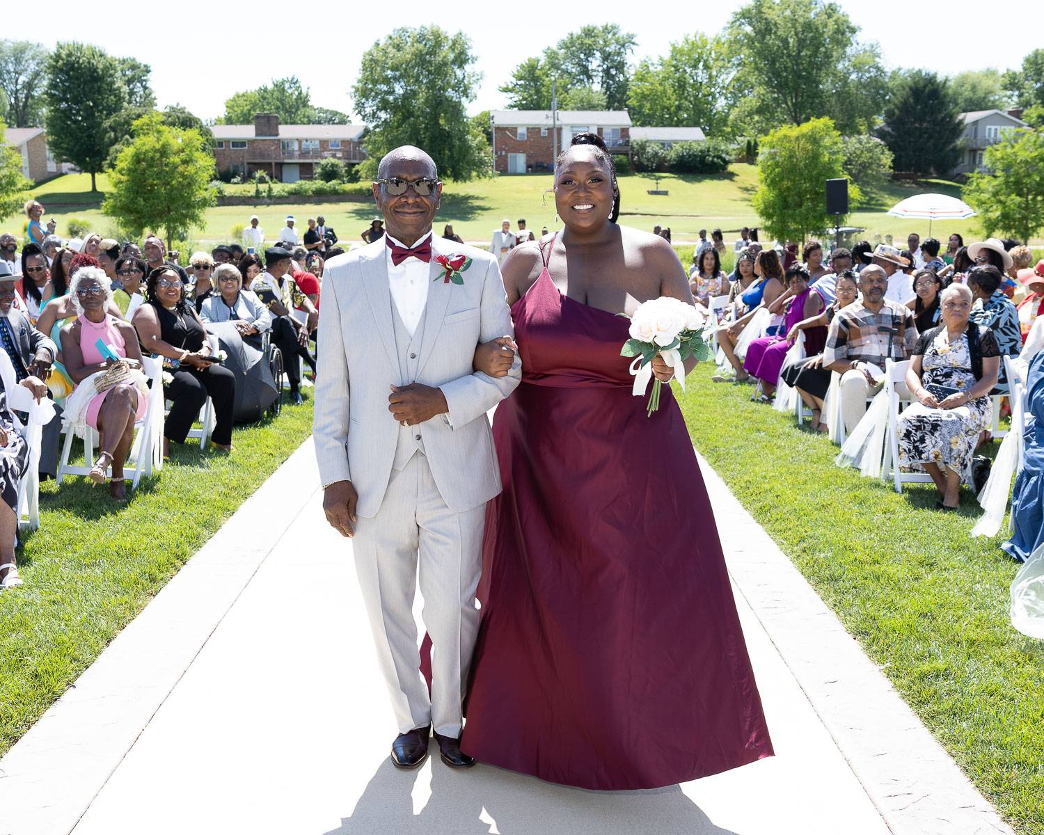 A woman walking down the aisle with a man
