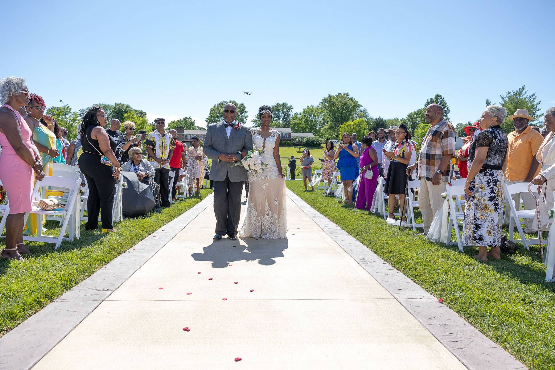 The bride walking on a large white carpet