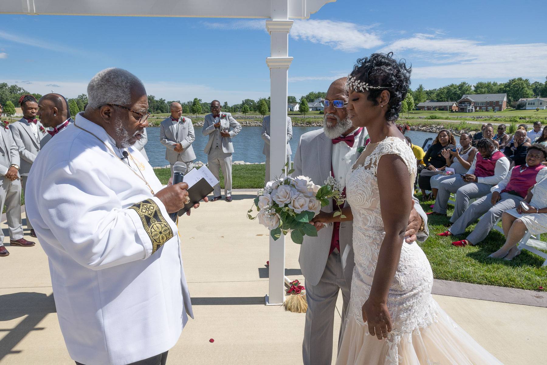 The bride and the bearded groom facing the officiant