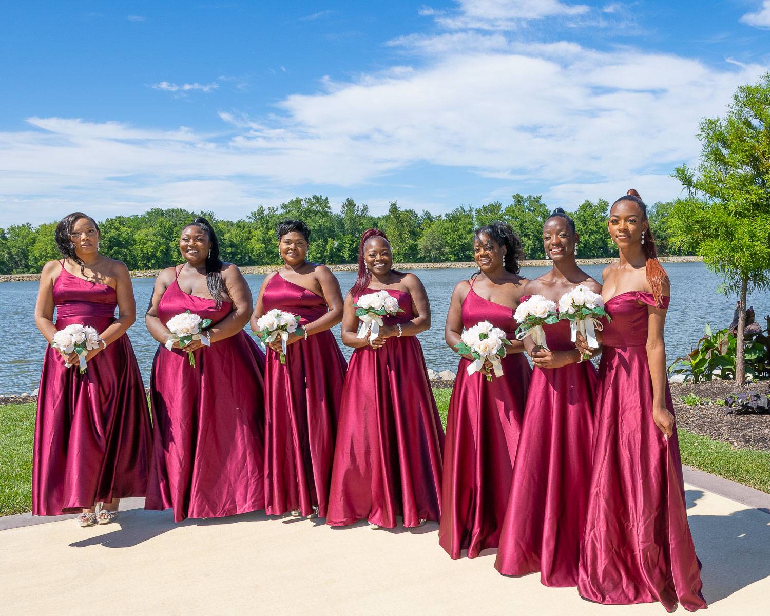 The bride’s attendants wearing magenta dresses